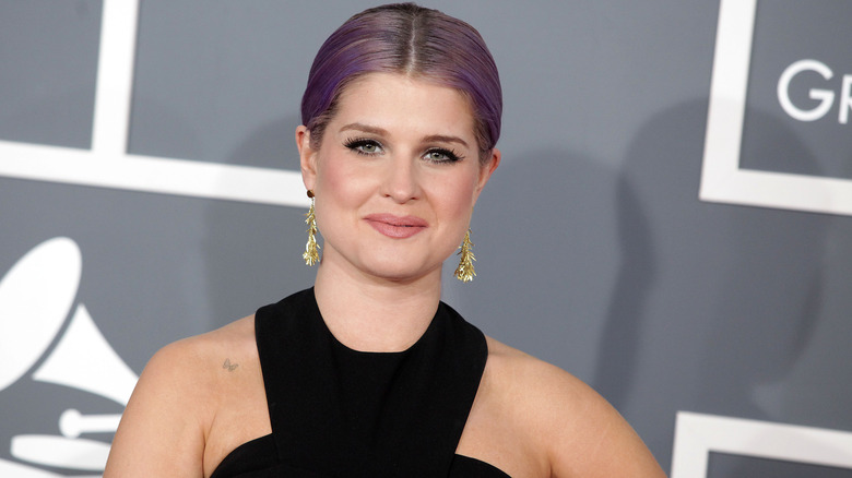 Kelly Osbourne smiling red carpet