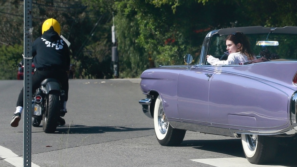 Kendall Jenner and a man who appears to be Harry Styles driving in L.A.