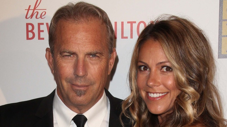 Kevin Costner and Christine Baumgartner posing