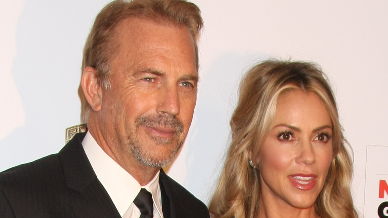 Kevin Costner and Christine Baumgartner posing