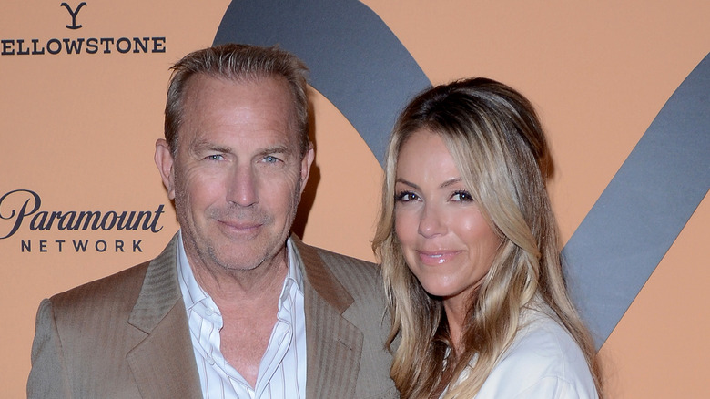 Kevin Costner and Christine Baumgartner posing