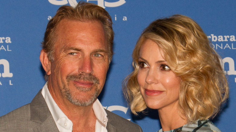 Kevin Costner and Christine Baumgartner posing