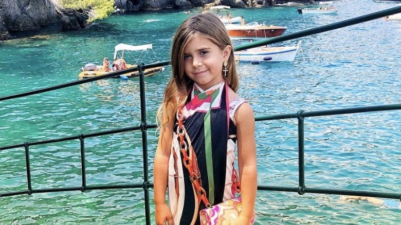 Penelope Disick smiling by the ocean