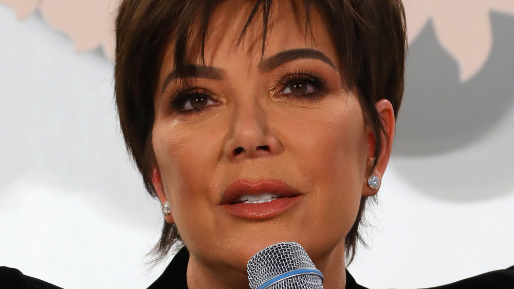 Kris Jenner speaking into microphone