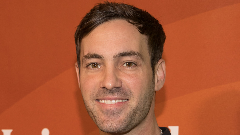 Jeff Dye on red carpet, smiling