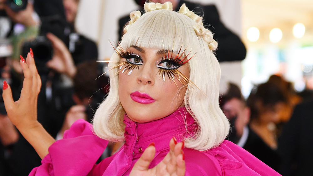 Lady Gaga posing in a pink dress at the Met Gala