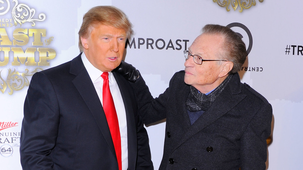 Donald Trump and Larry King posing 