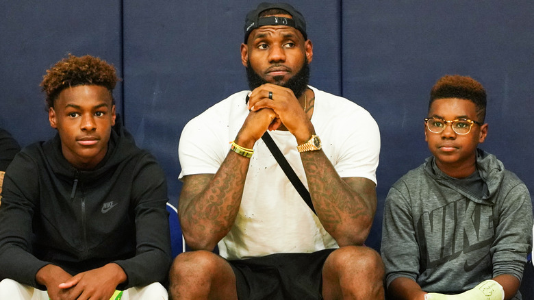 Bronny, LeBron and Bryce James seated