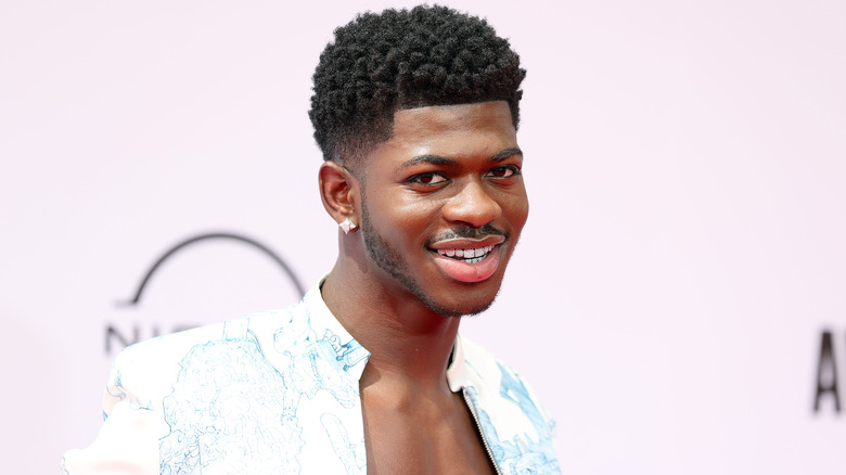 Lil Nas smiling on the red carpet