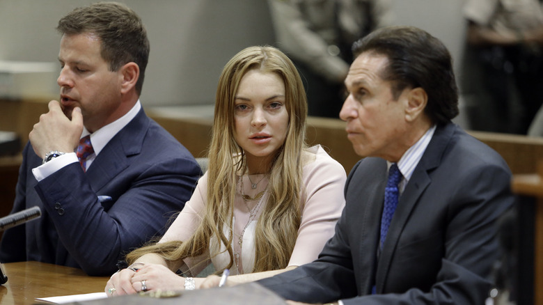 Lindsay Lohan with lawyers in court in 2012.