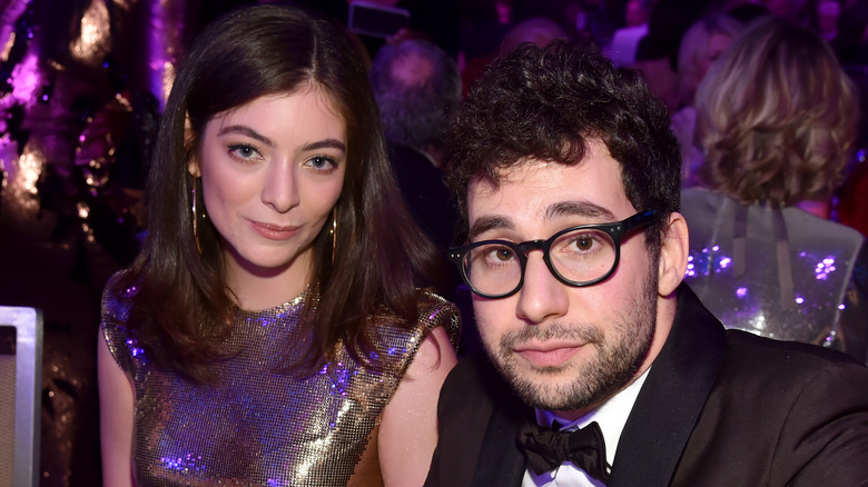 Lorde and Jack Antonoff with serious expression