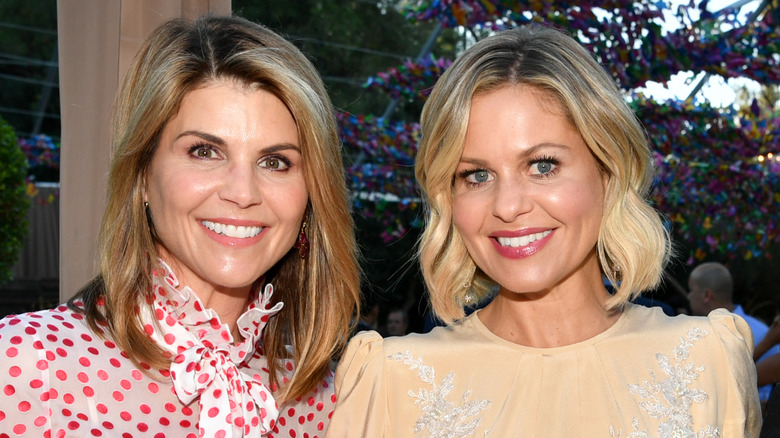 Lori Loughlin and Candace Cameron Bure pose