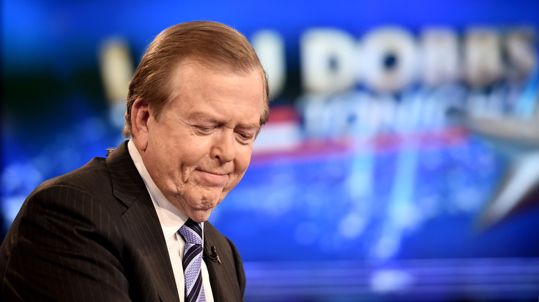 Lou Dobbs frowing