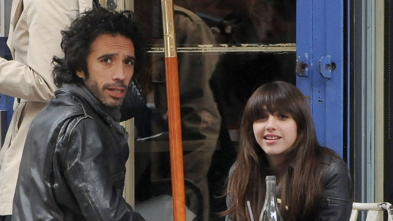 Carlos and Lourdes Leon looking at photographer