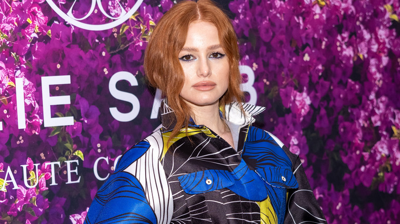 Madelaine Petsch against purple backdrop