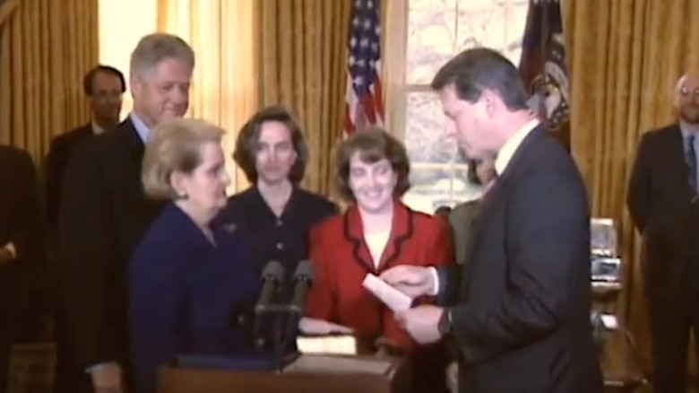 Madeleine Albright being sworn in by Al Gore as Secretary of State alongside her daughters and Bill Clinton