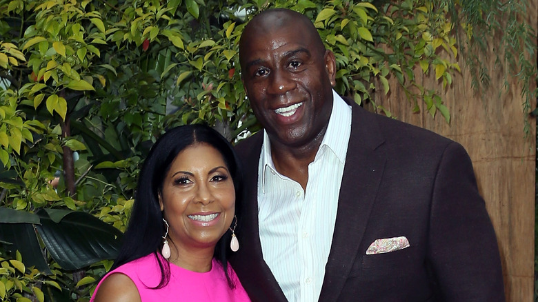 Cookie Johnson and Magic Johnson smiling