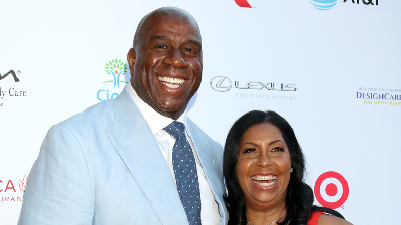 Magic Johnson and Cookie Johnson smiling
