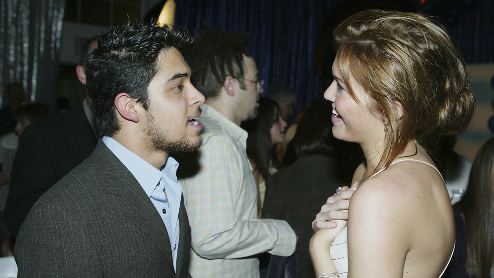 Wilmer Valderrama and Mandy Moore talking