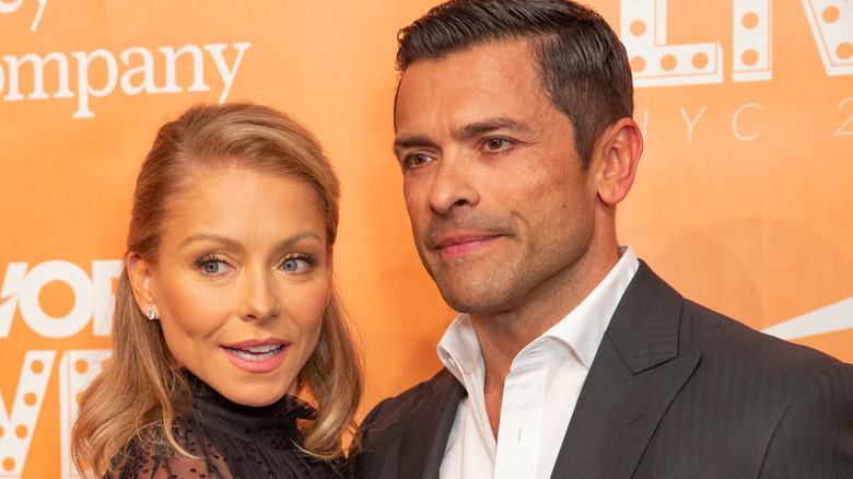 Kelly Ripa and Mark Consuelos posing