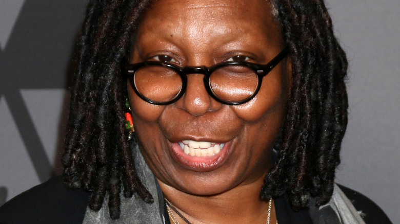 Whoopi Goldberg speaking on the red carpet