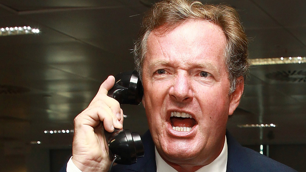Piers Morgan looking angry on the phone 