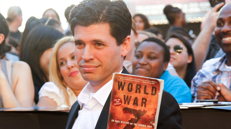 Max Brooks holding book