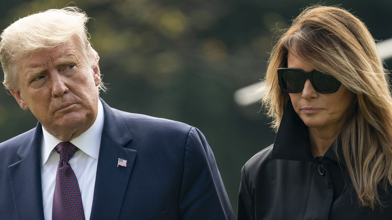 Donald and Melania Trump walking