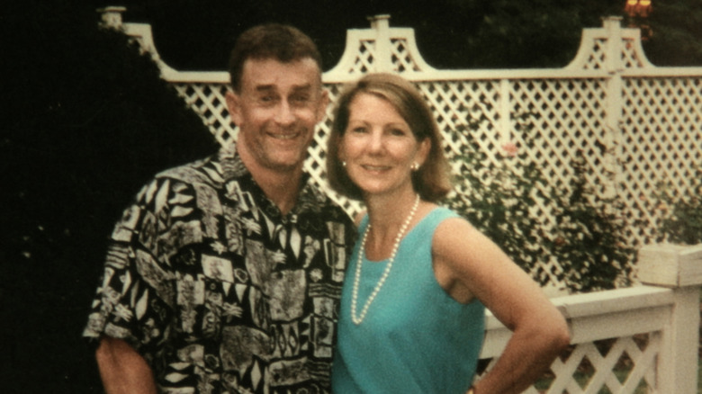 Kathleen and Michael Peterson posing on a backyard