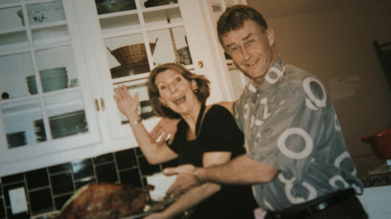 Kathleen and Michael Peterson pose with a turkey.