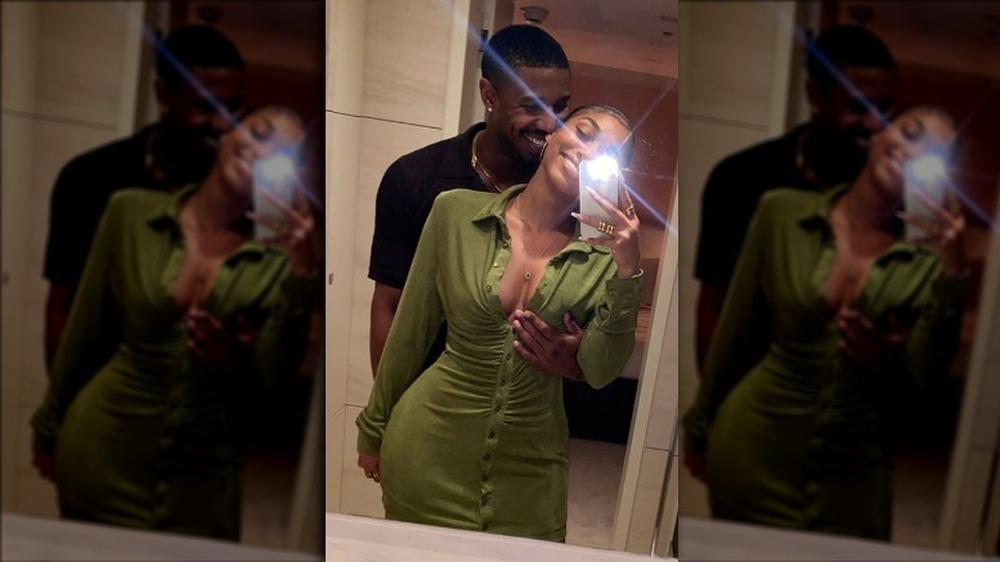 Michael B. Jordan and Lori Harvey laughing in a mirror selfie 