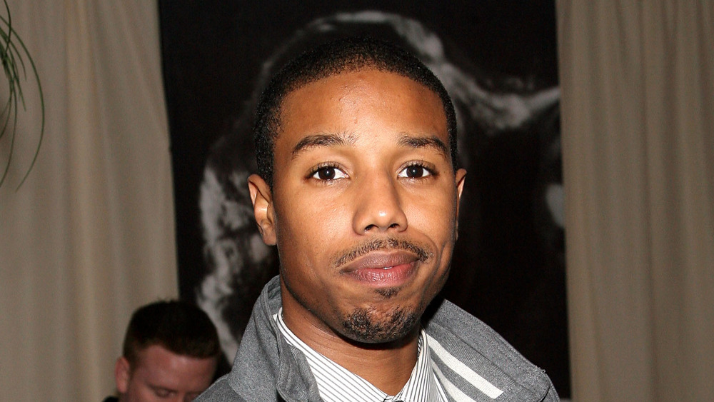 Michael B. Jordan smiling at camera