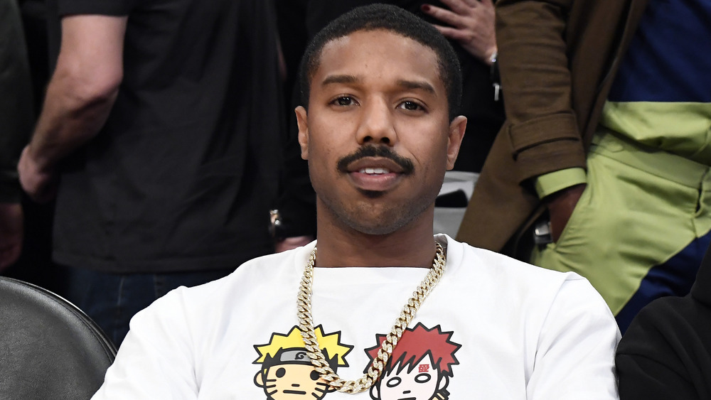 Michael B. Jordan watching basketball