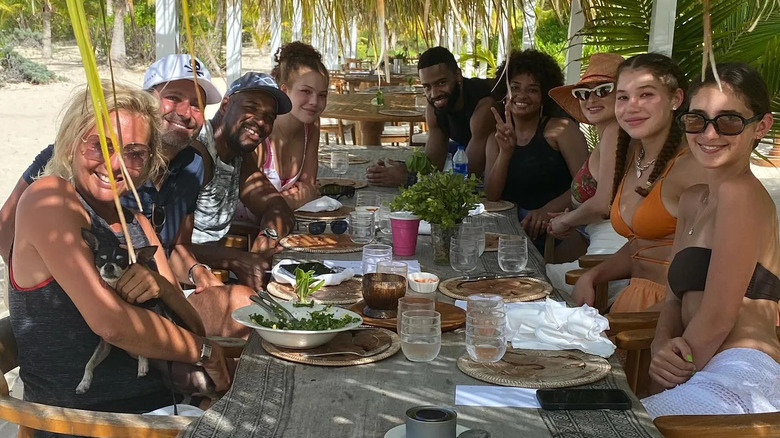 Michael Strahan and his family grinning over family meal