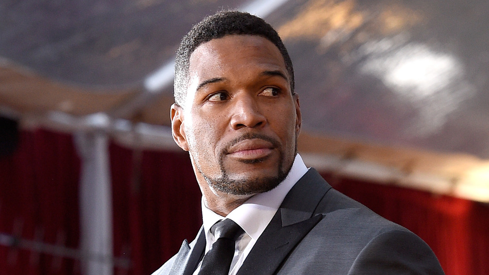 Michael Strahan with a serious expression