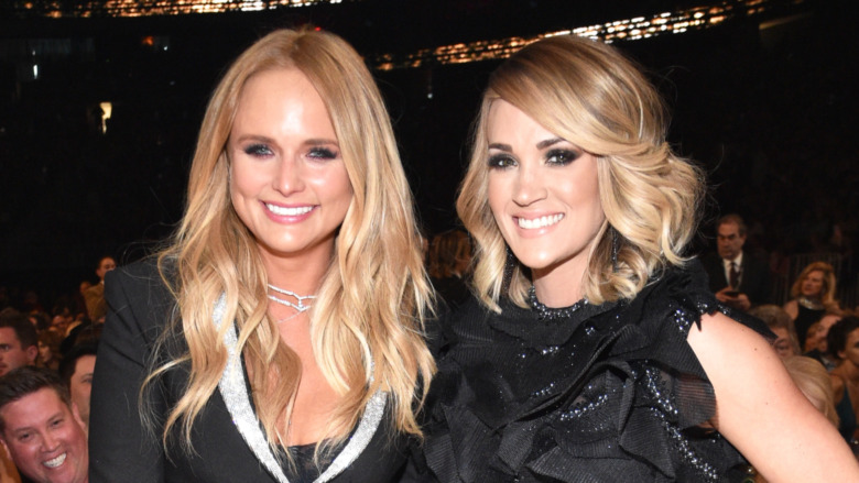 Miranda Lambert and Carrie Underwood smiling