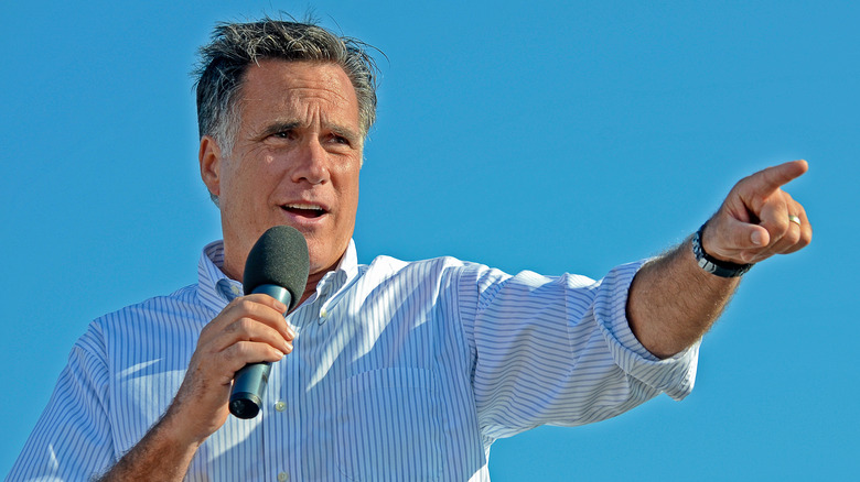 Mitt Romney campaigns for President 2012 bright blue sky behind him in Michigan