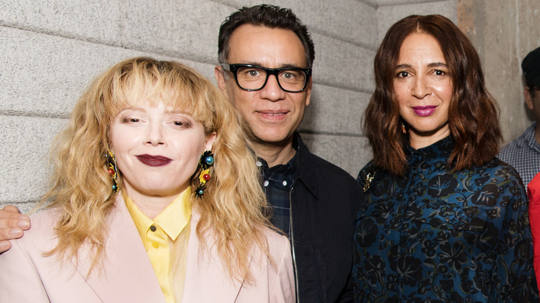 Natsha Lyonne smiling with Fred Armisen and Maya Rudolph