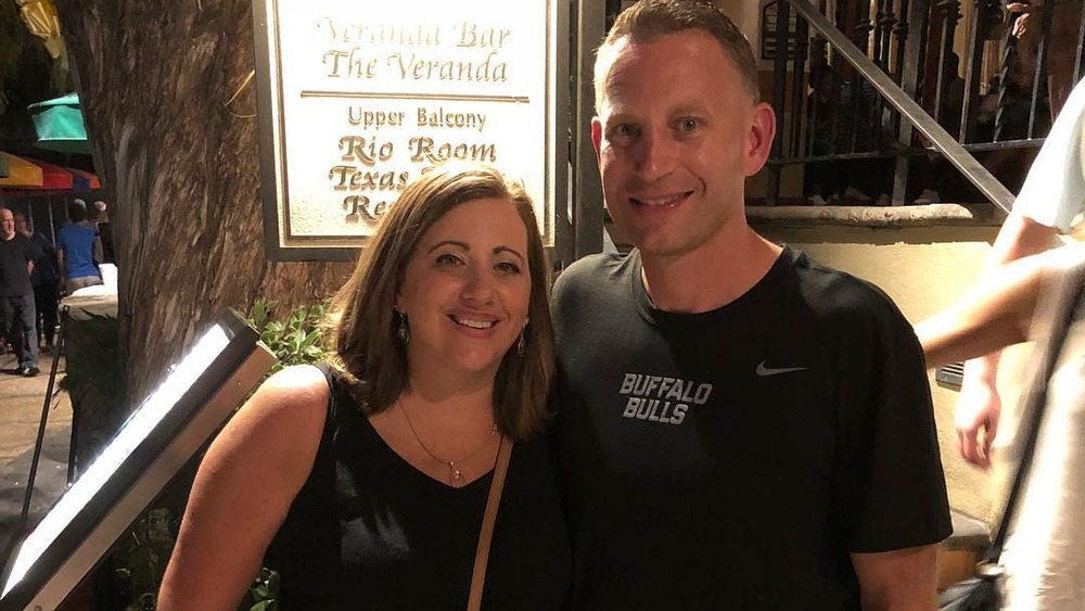 Crystal Oats and Nate Oats posing outside a restaurant in an Instagram photo