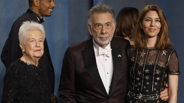 Francis Ford Coppola, posing with his wife and daughter Sofia