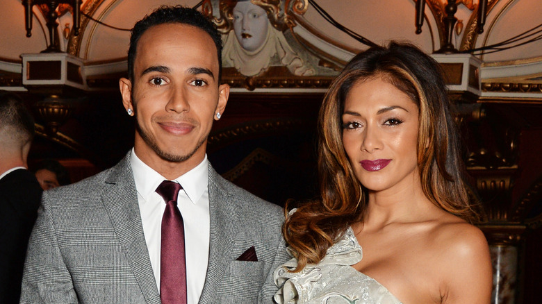 Lewis Hamilton and Nicole Scherzinger smiling