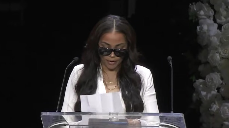 Lauren London speaking at memorial