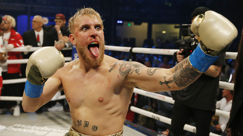 Jake Paul sticking tongue out in boxing ring