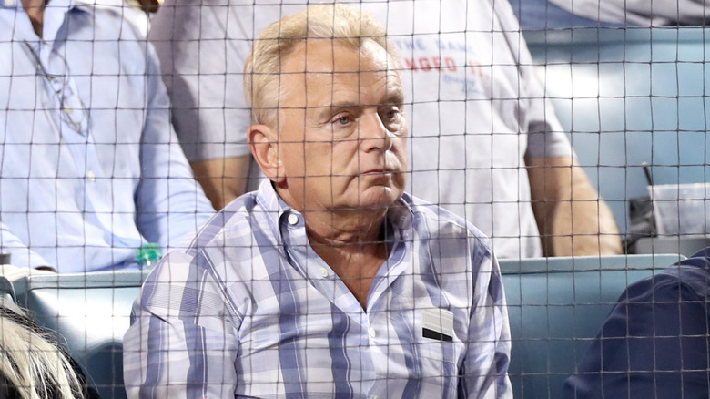 Pat Sajak watching baseball game