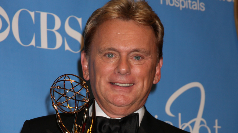 Pat Sajak posing with Emmy