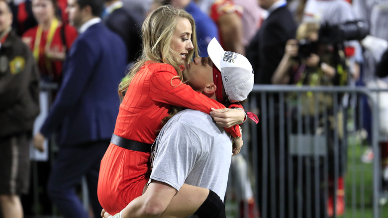 Patrick Mahomes and Brittany Matthews celebrate win