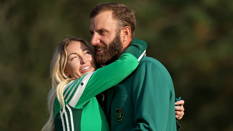 Dustin Johnson celebrating with fiancée Paulina Gretzky during the Green Jacket Ceremony after winning the Masters at Augusta National Golf Club