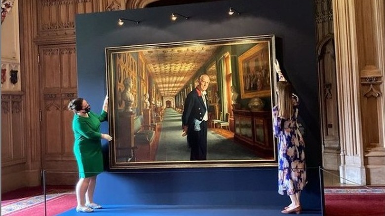 Royal staff hang Prince Philip's portrait