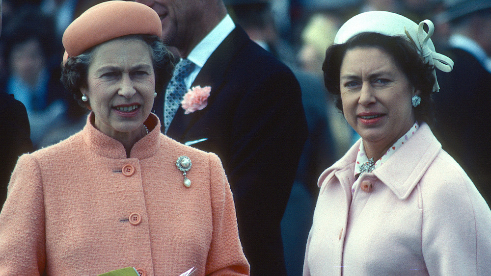 Queen Elizabeth and Princess Margaret staring