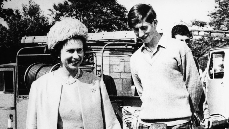 Queen Elizabeth II and King Charles III smiling